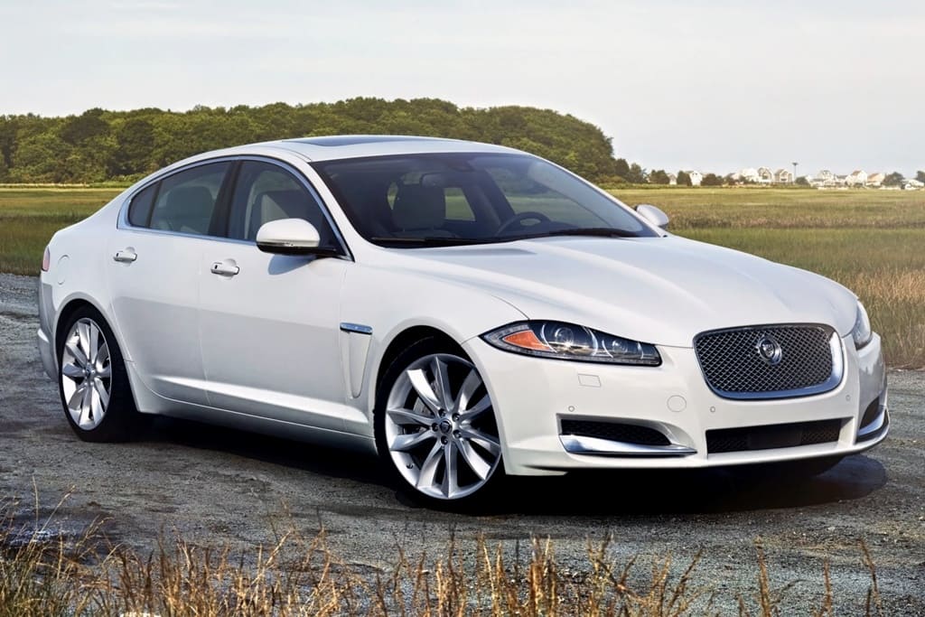 A parked white 2015 Jaguar XF Supercharged
