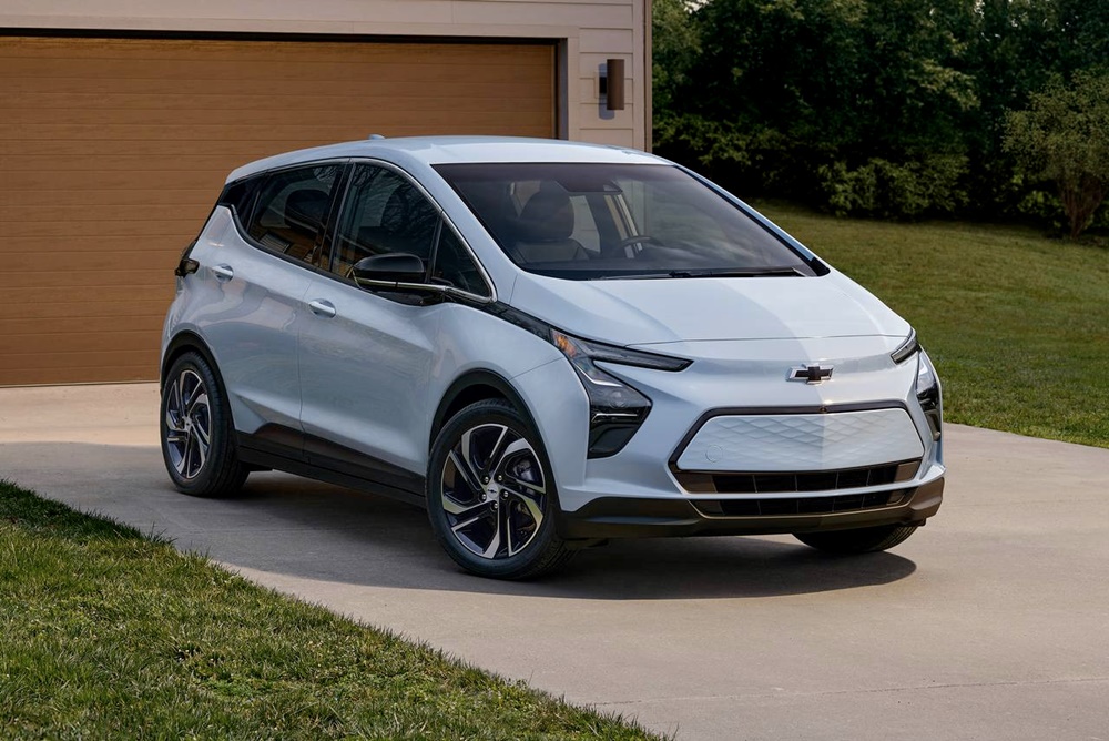 A parked light blue 2023 Chevrolet Bolt