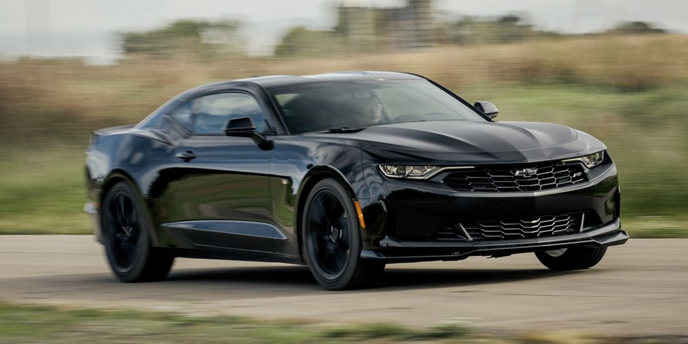 A black 2023 Chevrolet Camaro cruising down the road