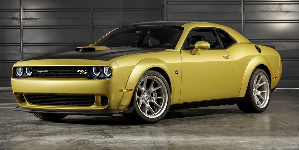 A parked ochre-yellow 2023 Dodge Challenger