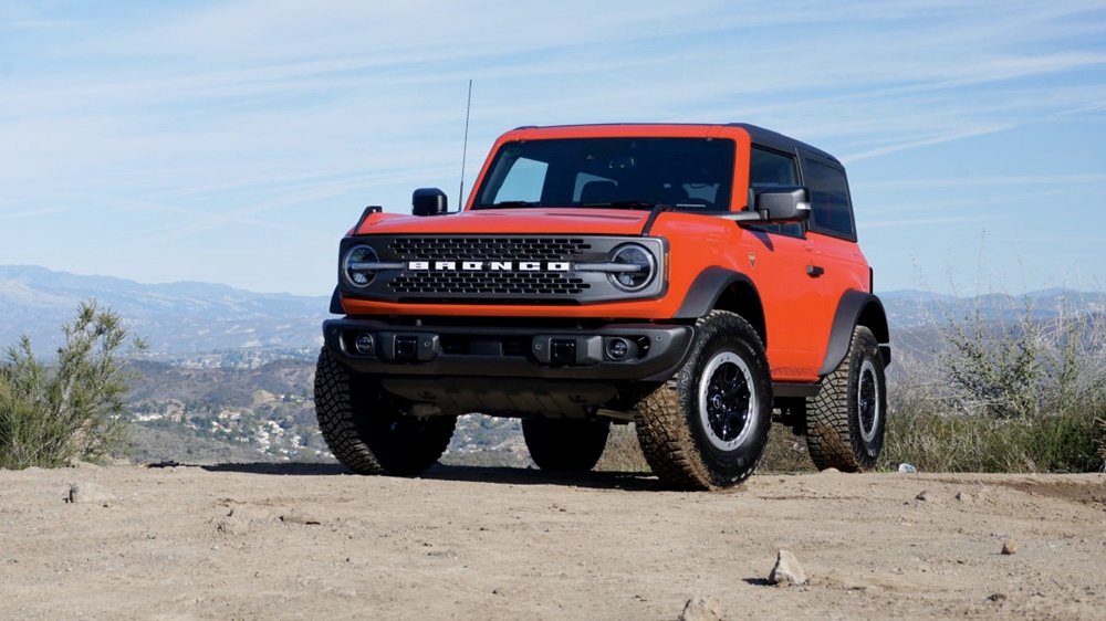 A parked bright orange 2023 Ford Bronco