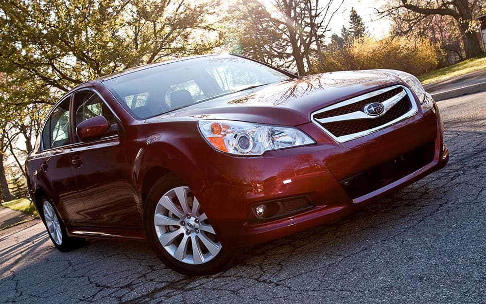A parked red 2012 Subaru Legacy