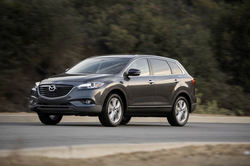 A black 2014 Mazda CX-9 on the move