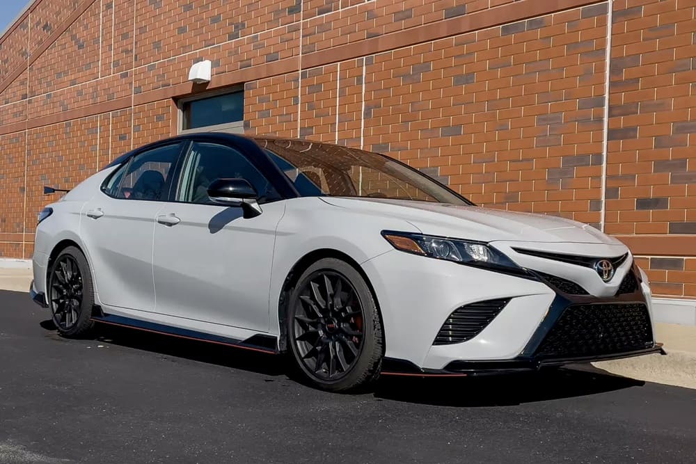 A parked white 2023 Toyota Camry TRD