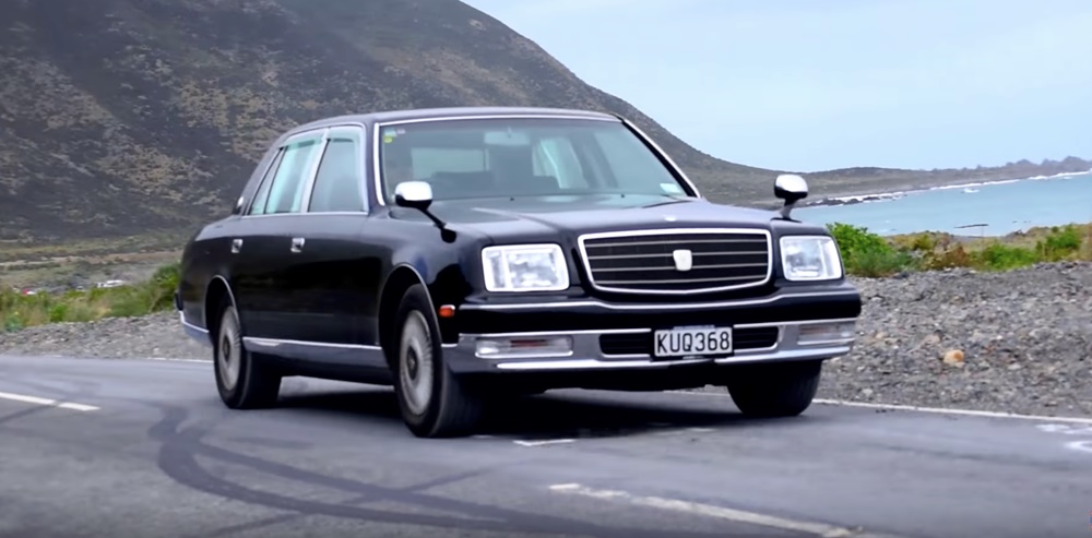 A black 1998 Toyota Century on the road