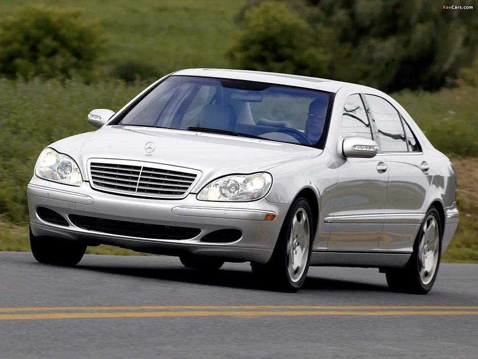 A silver 2002 Mercedes Benz S600 on the move